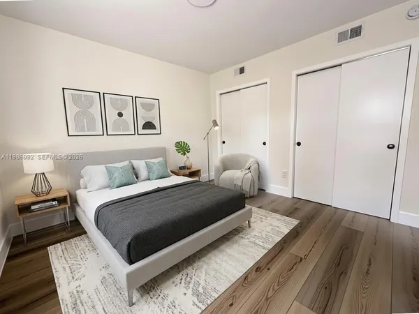 a kitchen with a refrigerator a stove a sink and a dining table