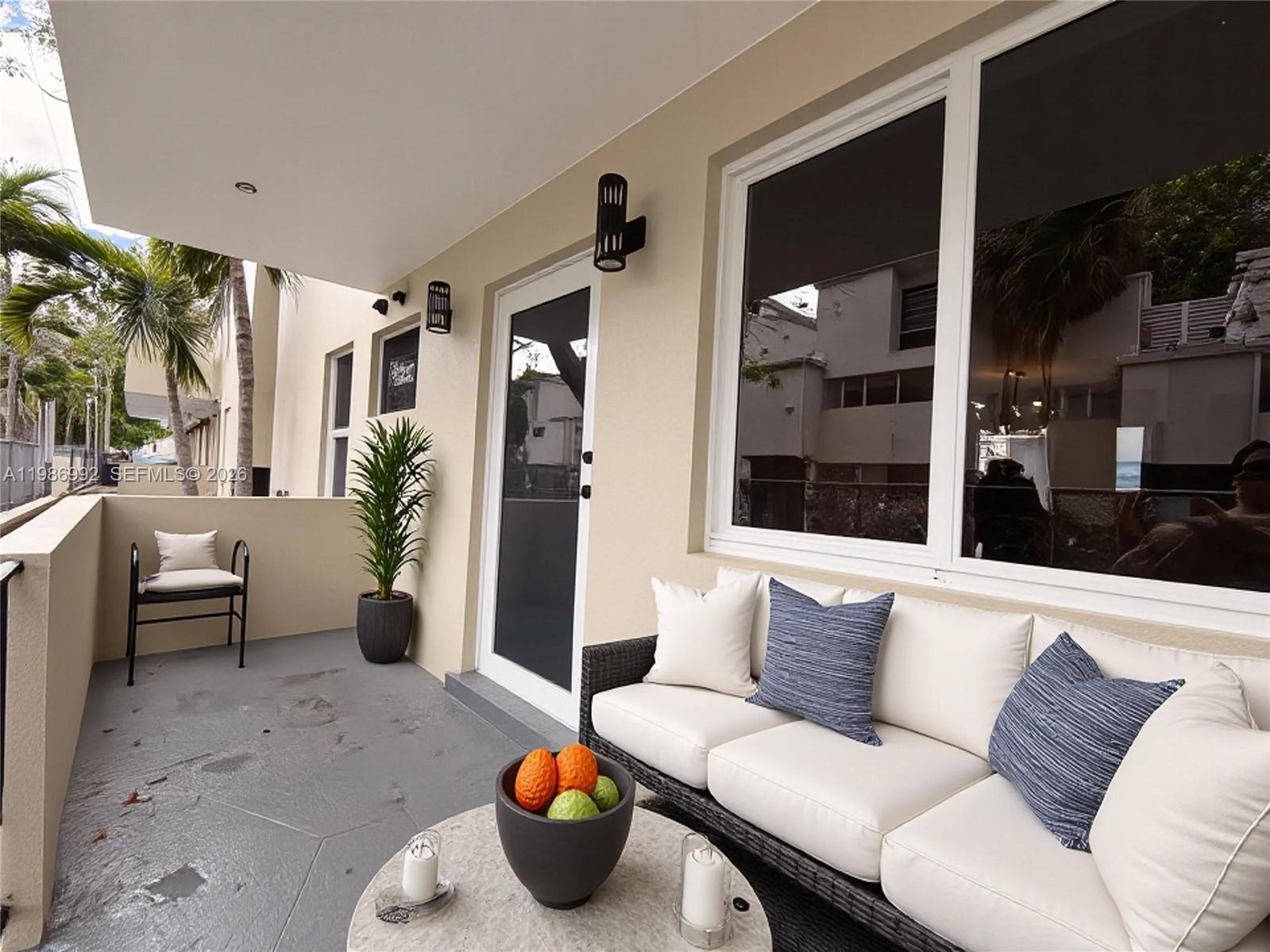 1904 Southwest 17th Avenue, Unit 3 Miami, FL 33145 - Photo 10 of 15 a living room with furniture and a potted plant