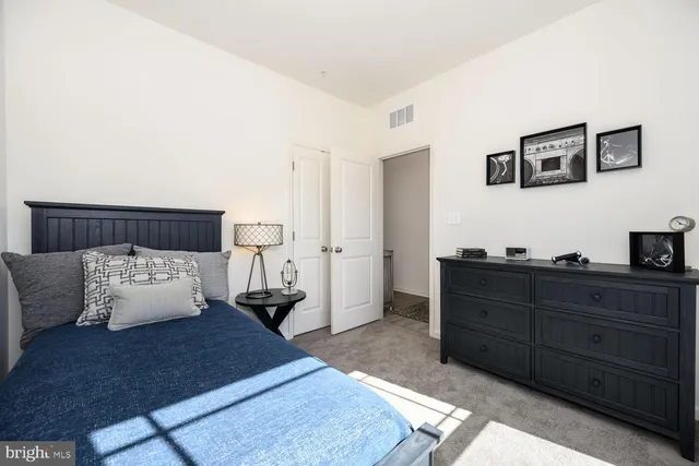 a bedroom with a bed and night stand