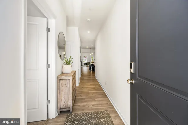 a view of a hallway with windows and stairs