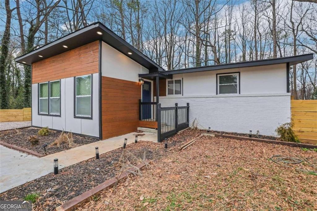 2230 Brannen Road Southeast Atlanta, GA 30316 - Photo 1 of 1 a backyard of a house with barbeque oven table and chairs