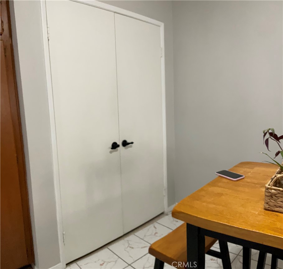 12620 Briarglen Loop, Unit I Stanton, CA 90680 - Photo 25 of 41 a view of a room with table and chair