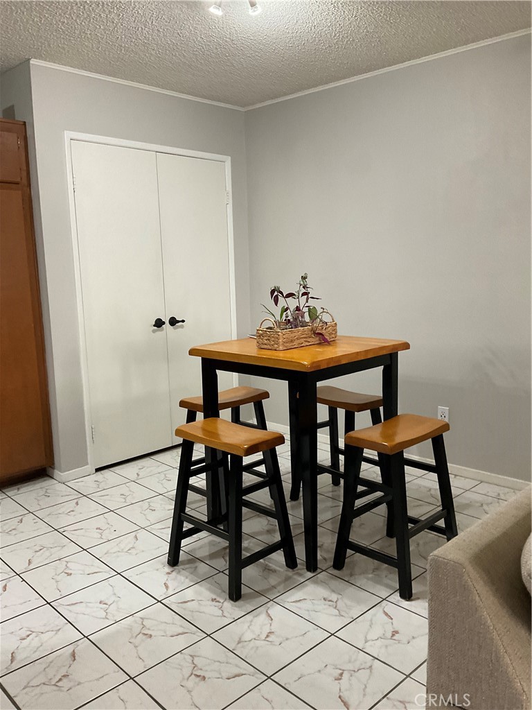 12620 Briarglen Loop, Unit I Stanton, CA 90680 - Photo 26 of 41 a workspace with furniture and wooden floor