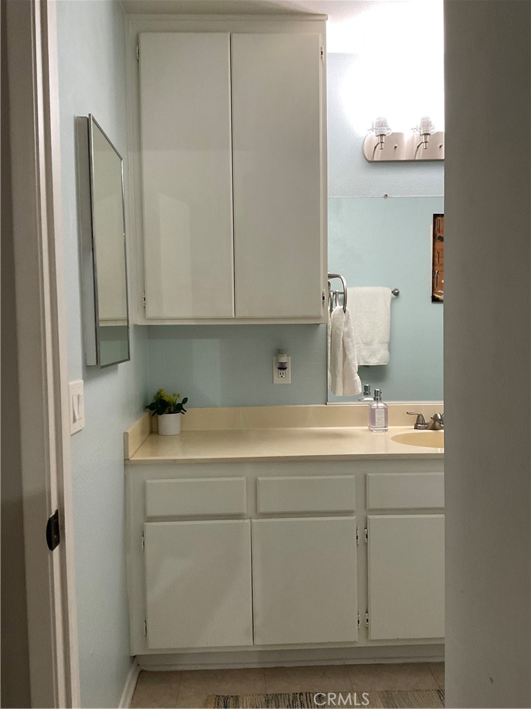 12620 Briarglen Loop, Unit I Stanton, CA 90680 - Photo 27 of 41 a room with a sink and cabinets