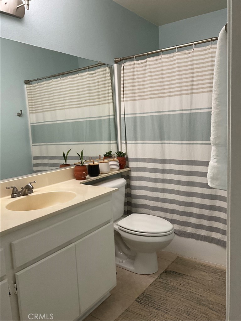 12620 Briarglen Loop, Unit I Stanton, CA 90680 - Photo 28 of 41 a bathroom with a sink and a toilet