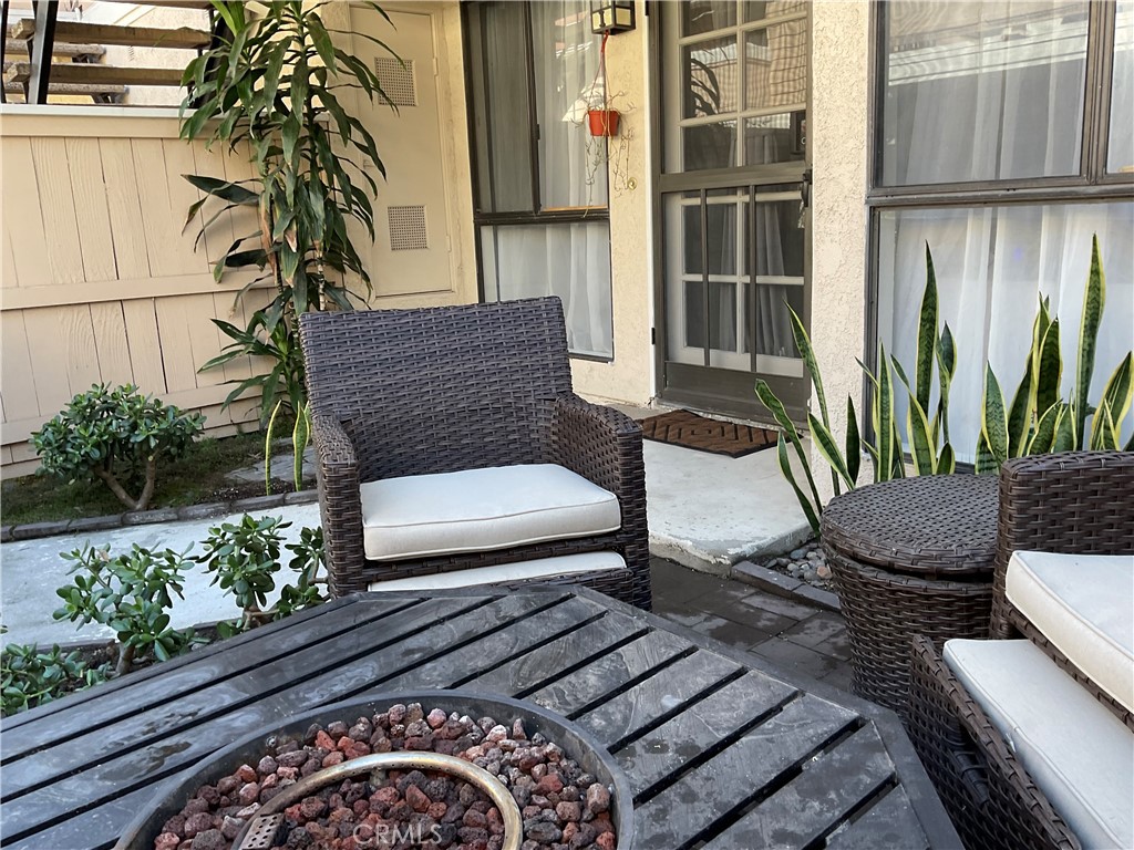12620 Briarglen Loop, Unit I Stanton, CA 90680 - Photo 6 of 41 a view of a back yard of the house with a chair
