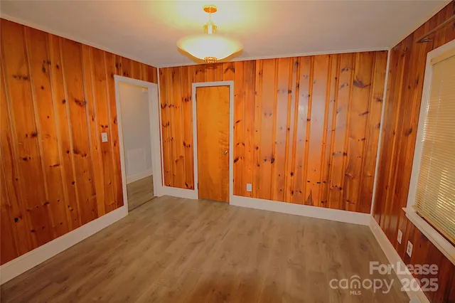 a view of a room with wooden walls