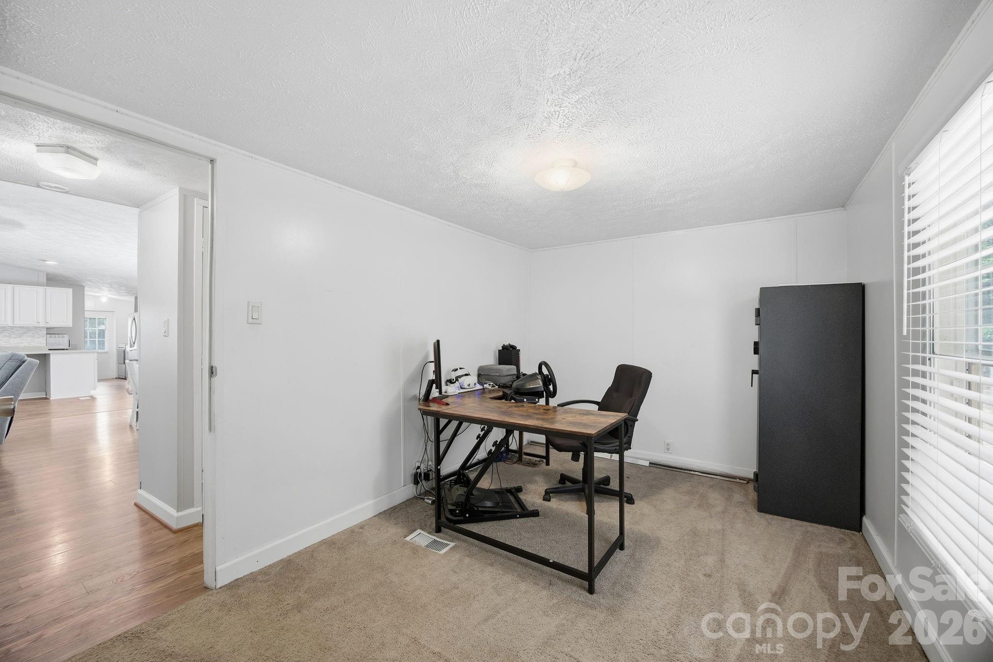 675 Overcash Road Salisbury, NC 28147 - Photo 30 of 48 a workspace with furniture and wooden floor