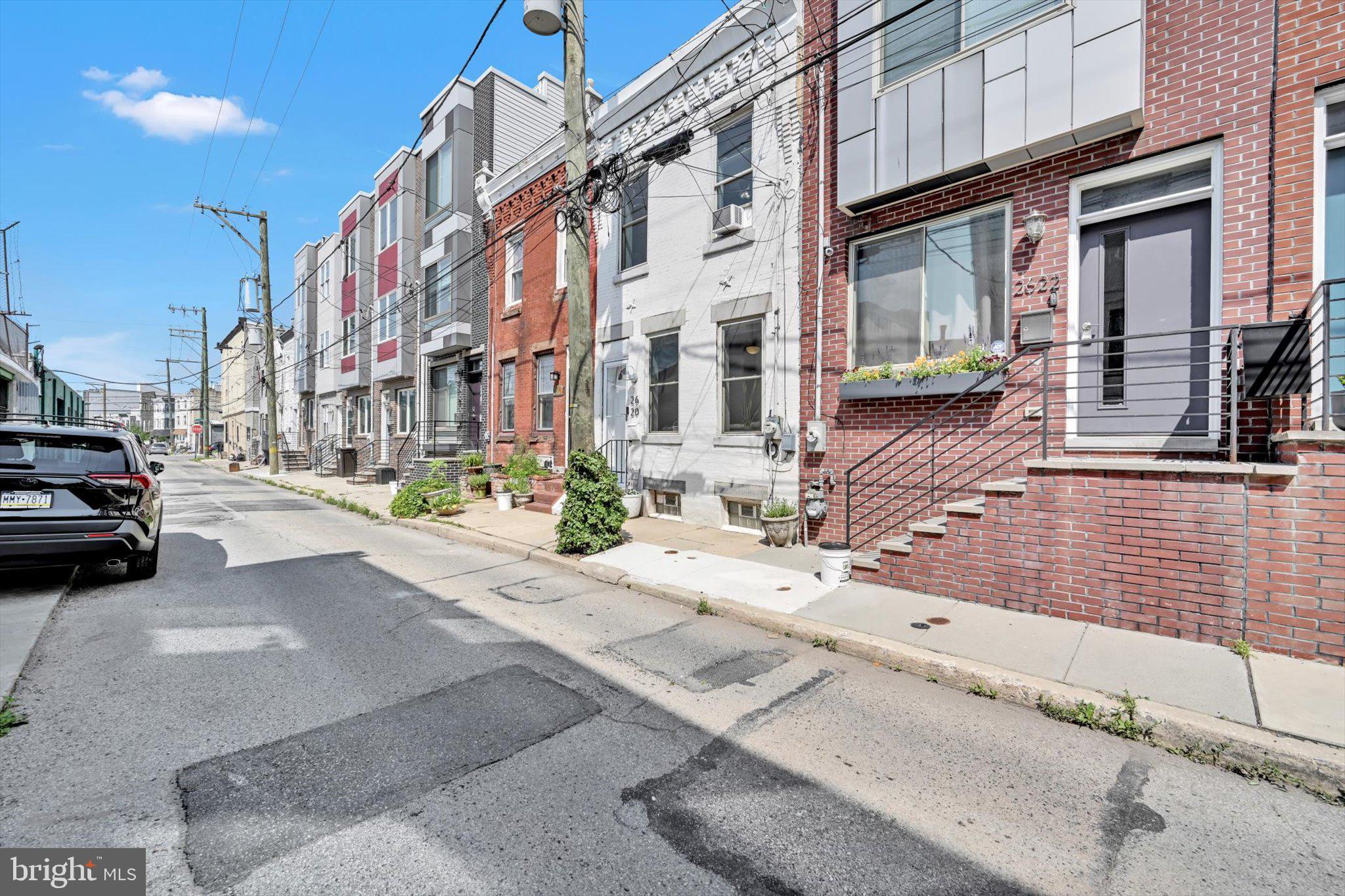 a view of a building and car parked