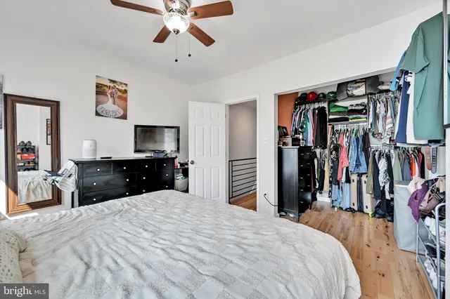 a bed room with a bed and a walk in closet