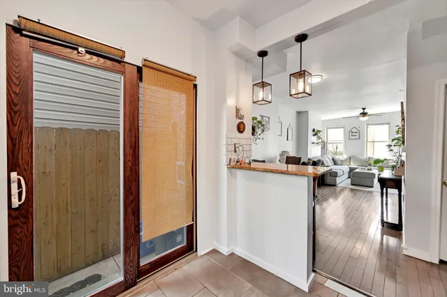 a view of a living room and hardwood floor