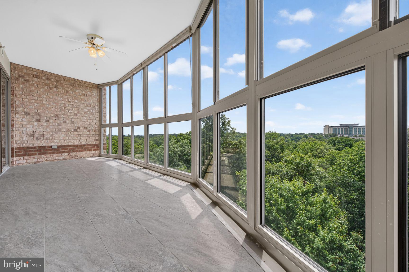19385 Cypress Ridge Terrace, Unit 903 Leesburg, VA 20176 - Photo 5 of 37 Panoramic view from large glass enclosed sunroom