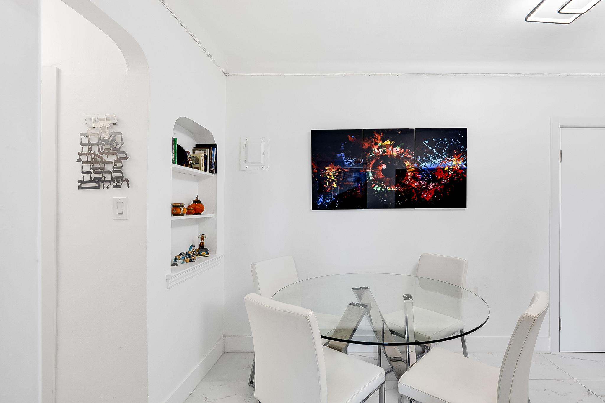 99-31 64th Avenue, Unit E10 Queens, NY 11374 - Photo 5 of 14 Dining room with built in shelves