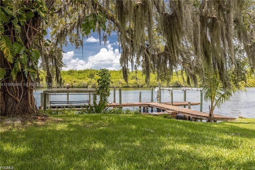 2030 Fort Denaud Road LaBelle, FL 33935 - Photo 5 of 25 a view of a wooden deck with a yard