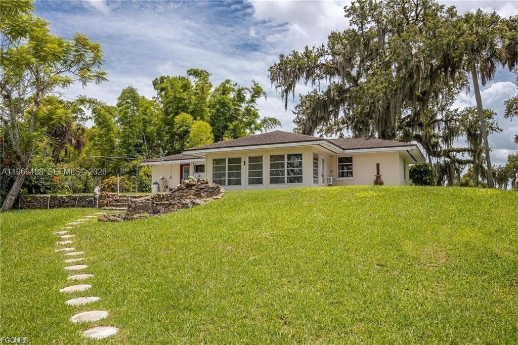 2030 Fort Denaud Road LaBelle, FL 33935 - Photo 8 of 25 a view of a house with swimming pool