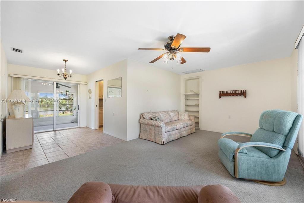 2030 Fort Denaud Road LaBelle, FL 33935 - Photo 9 of 25 a living room with furniture and a couch