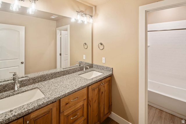 1997 West Cres Drive Mapleton, UT 84664 - Photo 23 of 35 Full bath featuring double vanity, wood finished floors, and bathtub / shower combination