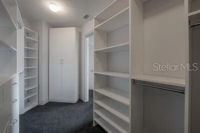 a bathroom with a toilet sink and shower