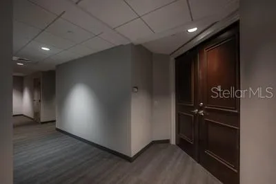 an empty room with wooden floor