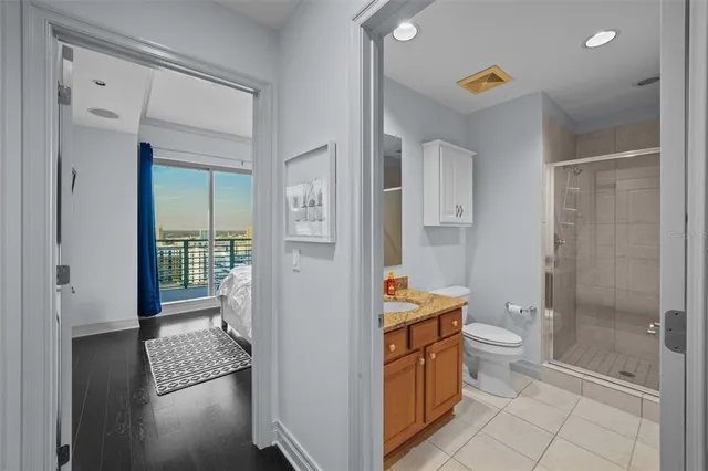 a bathroom with a toilet a sink and shower