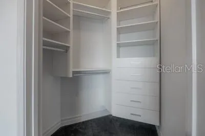 a bathroom with a granite countertop sink toilet a shower a mirror and a bathtub