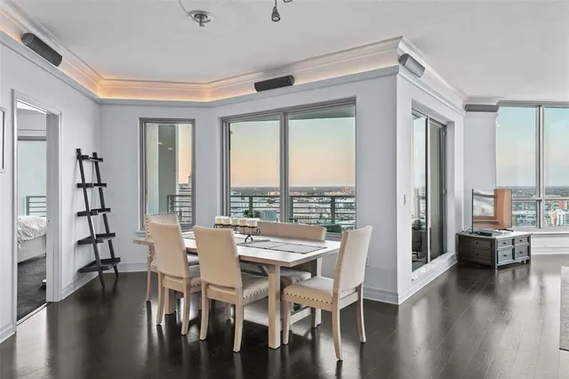 a view of a dining room with furniture and wooden floor