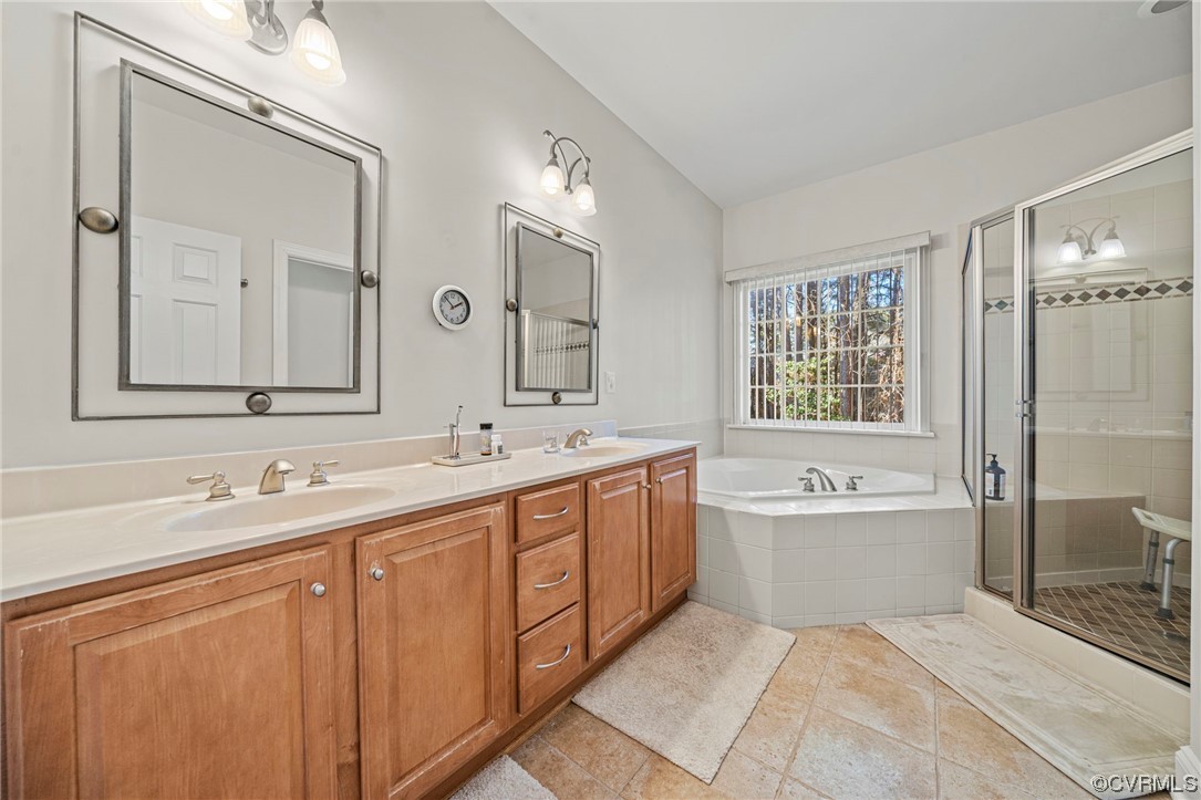 5124 Park Commons Loop Glen Allen, VA 23059 - Photo 15 of 30 a spacious bathroom with a bathtub shower sink double and mirror