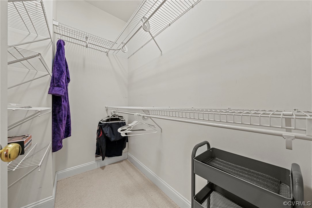 5124 Park Commons Loop Glen Allen, VA 23059 - Photo 16 of 30 a view of walk in closet with clothes and shoes
