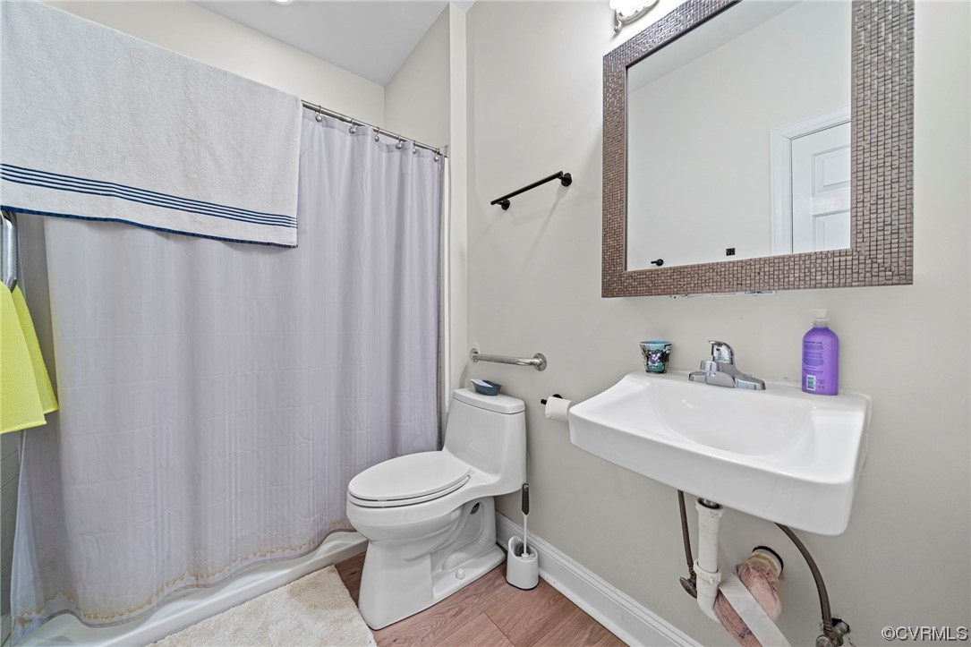 5124 Park Commons Loop Glen Allen, VA 23059 - Photo 19 of 30 a bathroom with a sink a toilet and a mirror