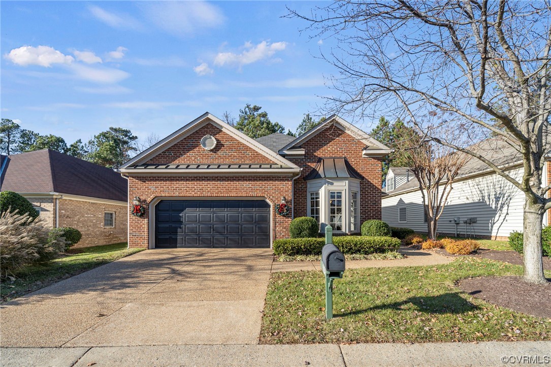 5124 Park Commons Loop Glen Allen, VA 23059 - Photo 2 of 30 a front view of a house with garden