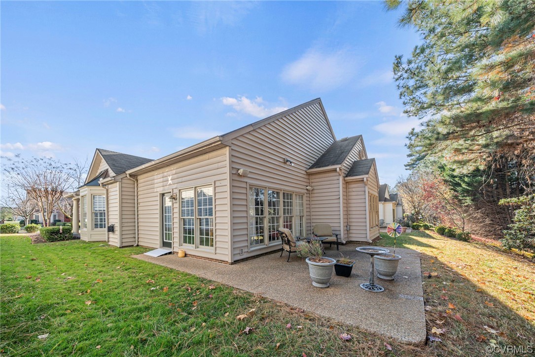 5124 Park Commons Loop Glen Allen, VA 23059 - Photo 26 of 30 a view of house with backyard and outdoor seating
