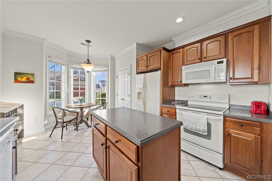 5124 Park Commons Loop Glen Allen, VA 23059 - Photo 10 of 30 a kitchen with stainless steel appliances granite countertop a stove top oven a sink dishwasher and white cabinets with wooden floor