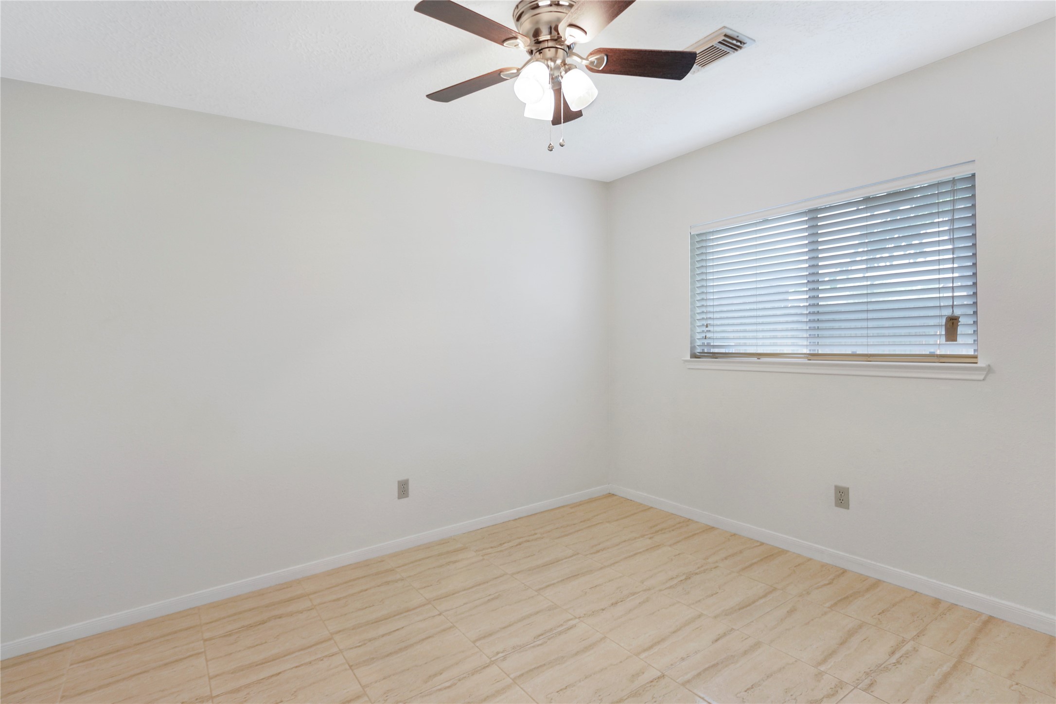 3226 Mourning Dove Drive Spring, TX 77388 - Photo 15 of 17 an empty room with a window and a fan