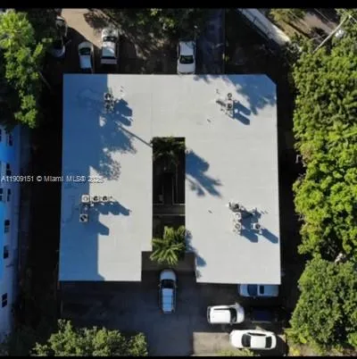 an aerial view of house with yard