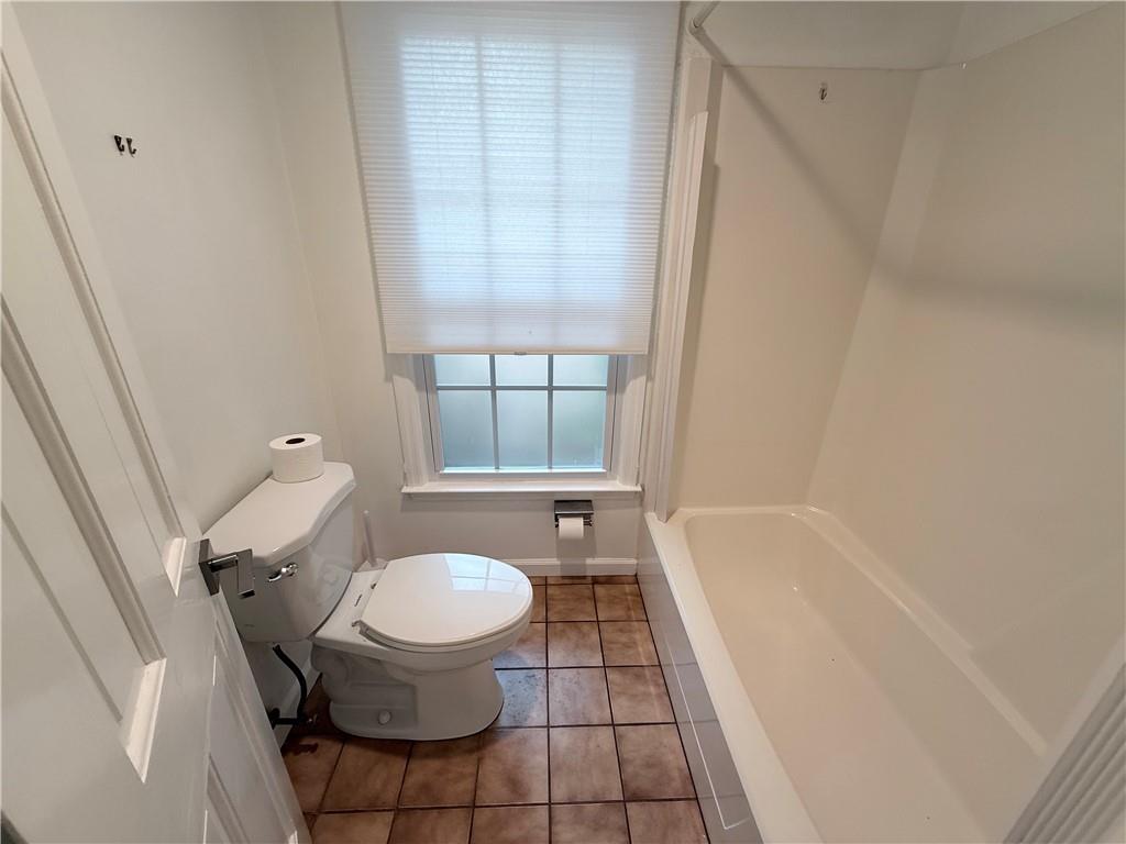 3033 Riviera Drive Conyers, GA 30012 - Photo 27 of 79 a bathroom with a sink a toilet and a tub