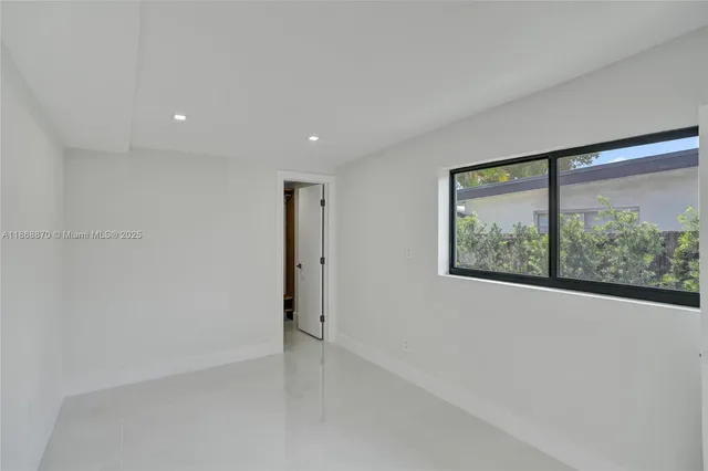 an aerial view of a house with a garden
