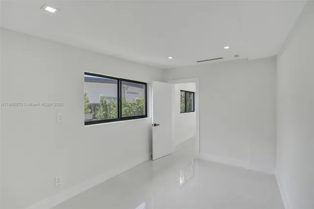 an aerial view of a house with a garden