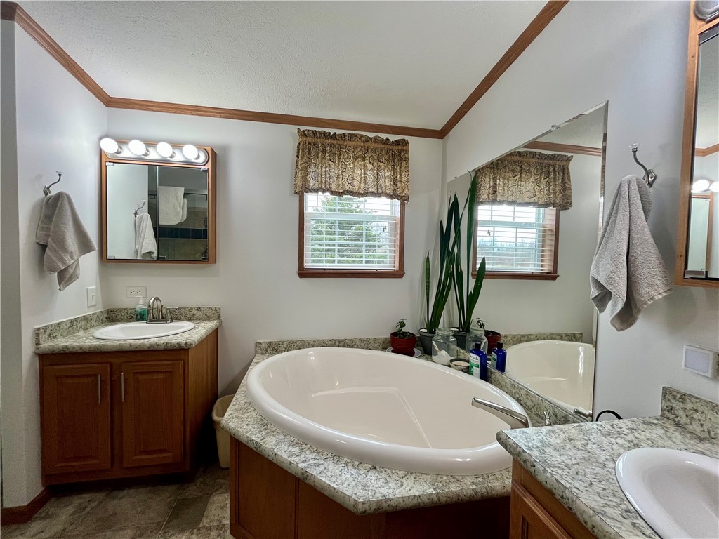 1452 State Route Sterling, NY 13156 - Photo 25 of 42 Primary bathroom with soaking tub, double vanity's