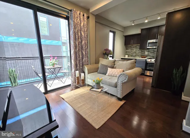 a living room with furniture and a table