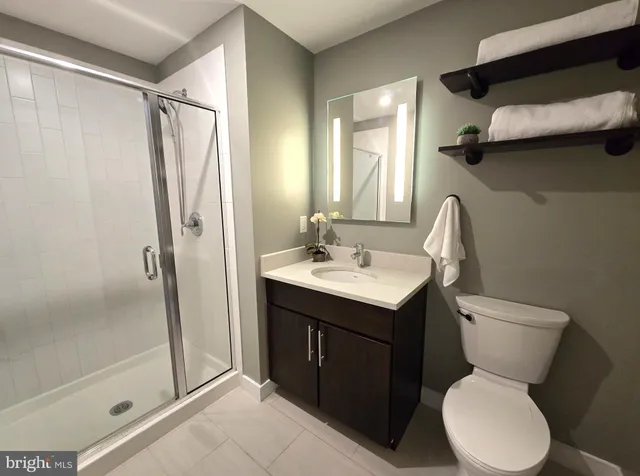 a bathroom with a toilet sink and shower