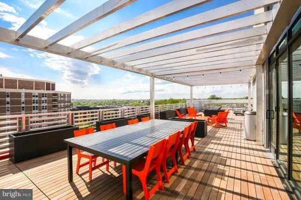 a balcony with furniture and city view