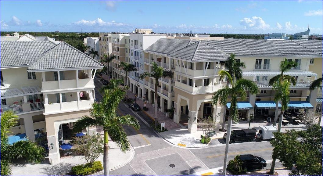 1209 Main Street, Unit 209 Jupiter, FL 33458 - Photo 14 of 14 a view of multiple houses with a yard