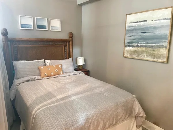 a bedroom with bed and window