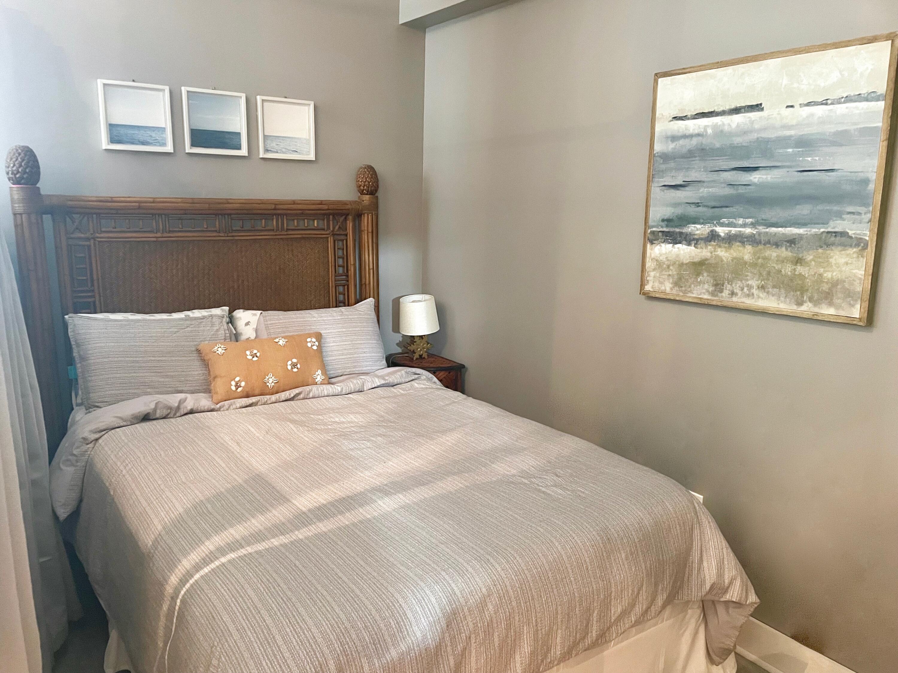 1209 Main Street, Unit 209 Jupiter, FL 33458 - Photo 6 of 14 a bedroom with bed and window