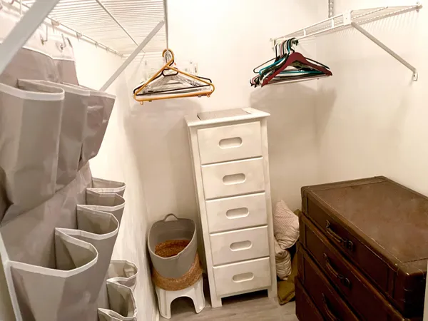 a view of an empty room and a window