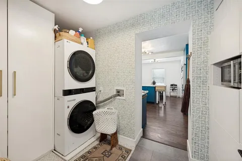 a view of a hallway with washer and dryer