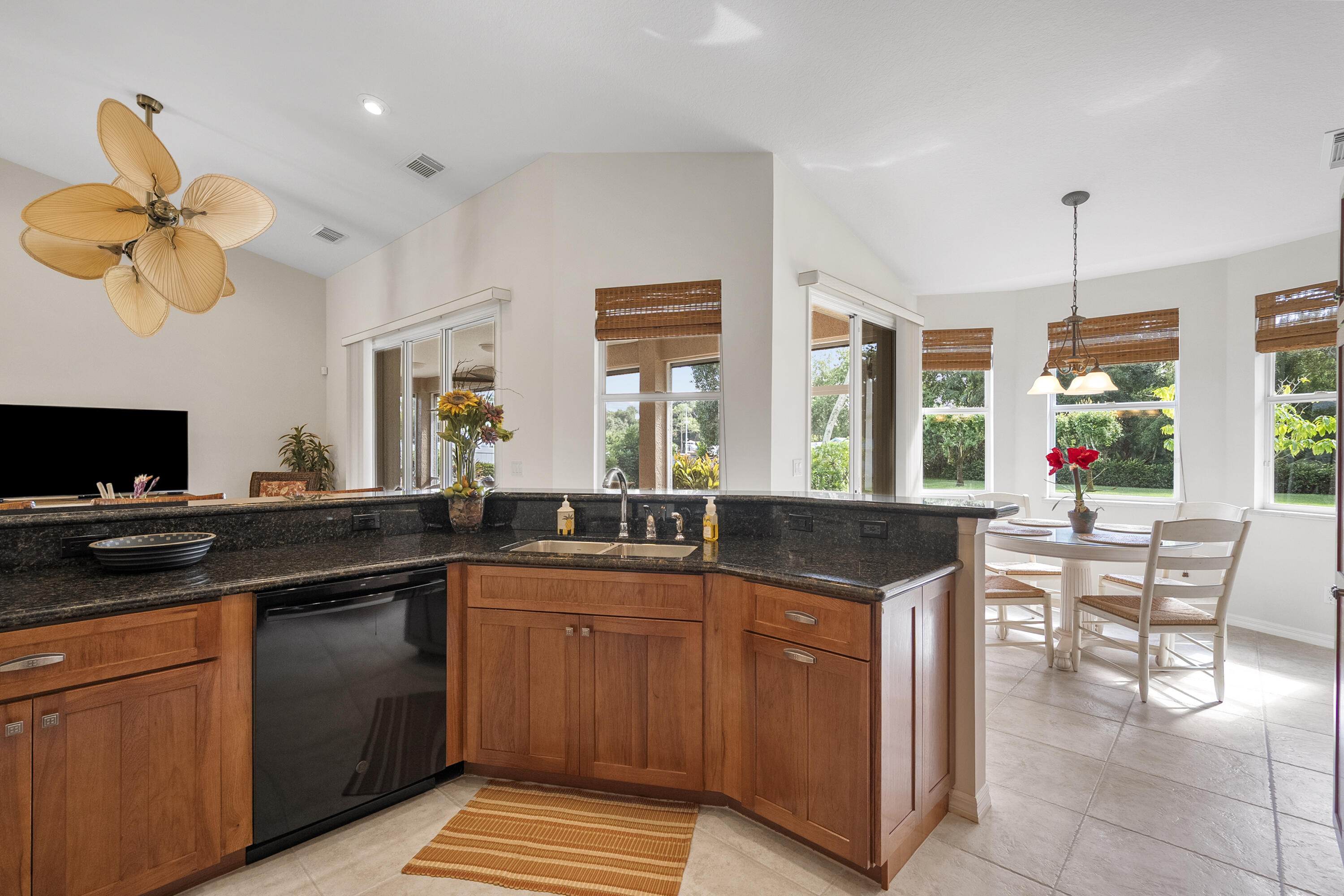 1234 Southwest Locks Road Stuart, FL 34997 - Photo 11 of 53 a kitchen with a cabinets a sink and stainless steel appliances