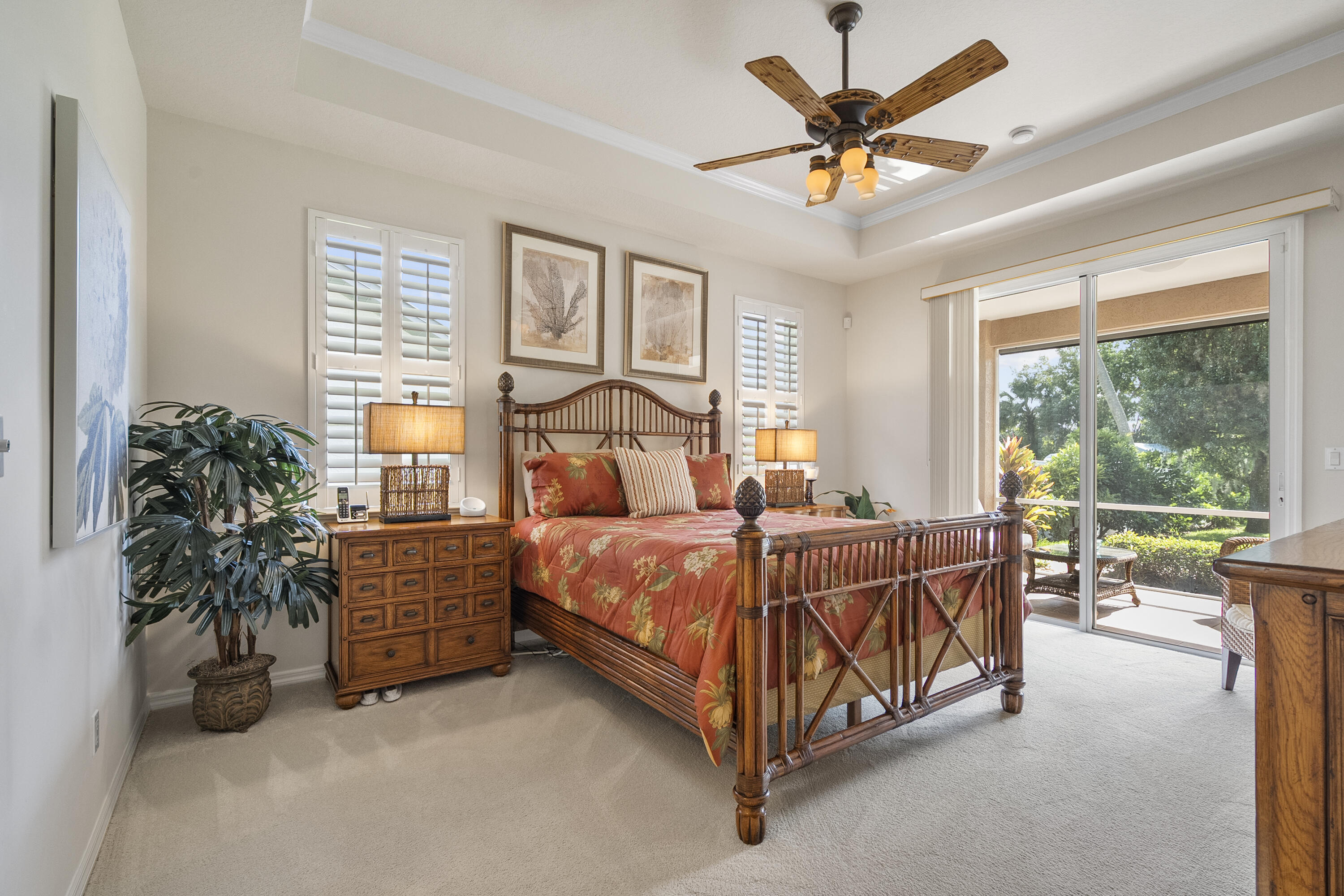 1234 Southwest Locks Road Stuart, FL 34997 - Photo 12 of 53 a bed sitting in a spacious bedroom next to a window