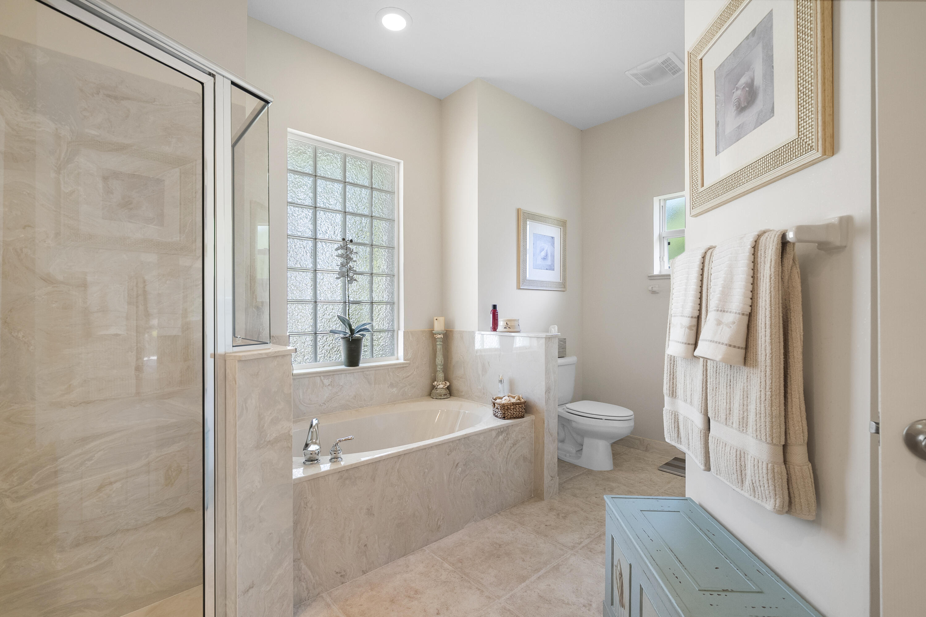 1234 Southwest Locks Road Stuart, FL 34997 - Photo 15 of 53 a bathroom with a granite countertop bathtub shower sink and toilet