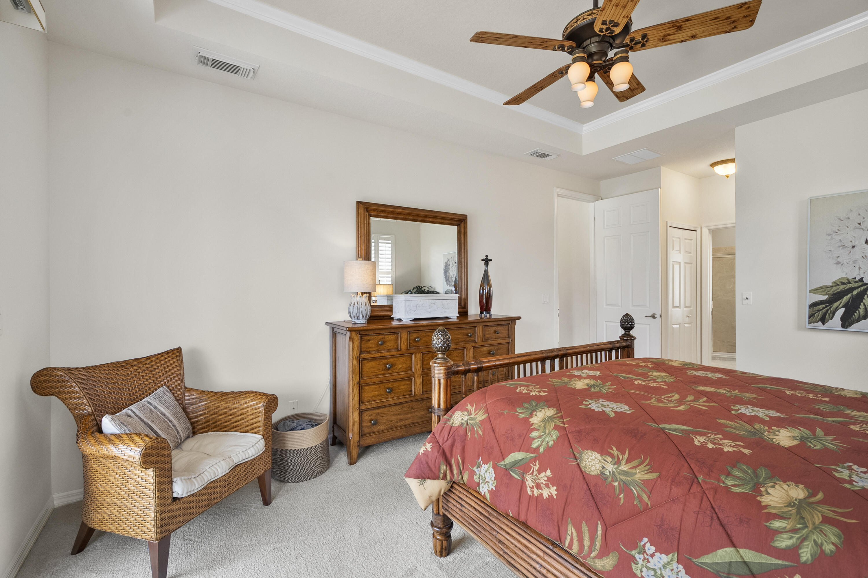 1234 Southwest Locks Road Stuart, FL 34997 - Photo 16 of 53 a bedroom with a bed and a chandelier